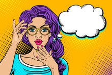 Wow Female Face. Sexy Surprised Young Woman In Glasses With Open Mouth And Bright Curly Hair And Empty Speech Bubble. Vector Colorful Background In Pop Art Retro Comic Style. Party Invitation Poster.