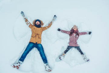 Dad with daughter outdoor in winter