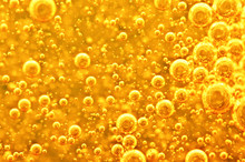 Golden Background With Big And Small Gold Bubbles Oil Inside A Gold Liquid