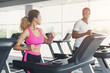 © Prostock-studio - Man and woman, couple in gym on treadmills