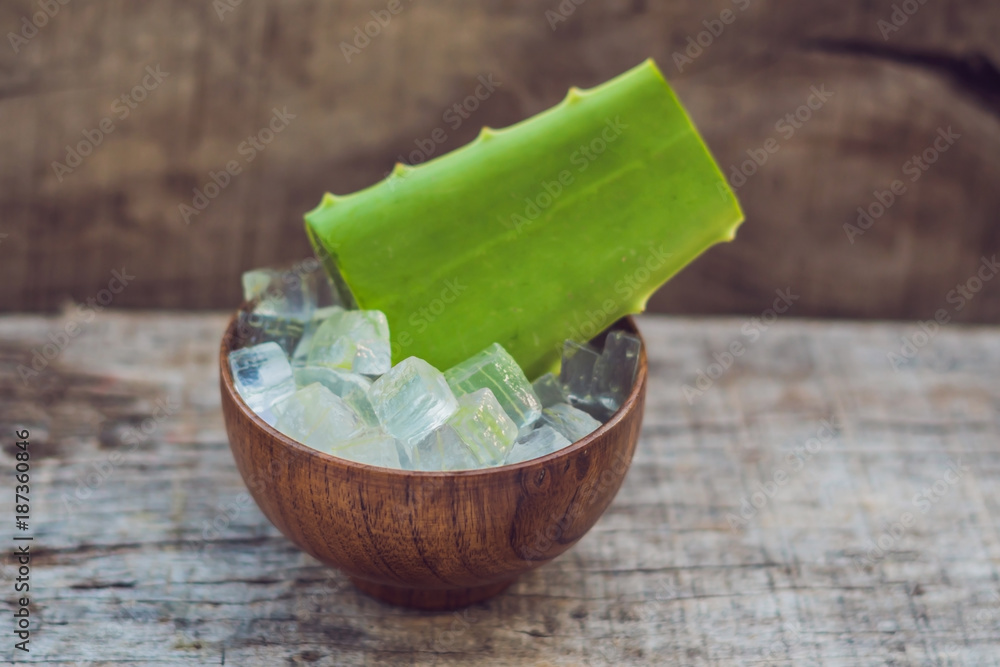 Aloe vera and aloe cubes in a wooden bowl. Aloe Vera gel almost use in  food, medicine and beauty industry Stock Photo | Adobe Stock