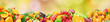 Fresh healthy fruits on natural blurred multicolored background.