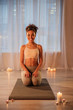 © Yakobchuk Olena - Healthy lifestyle concept. Full length portrait of joyful african girl having rest after workout. She is looking at camera and smiling with positivity