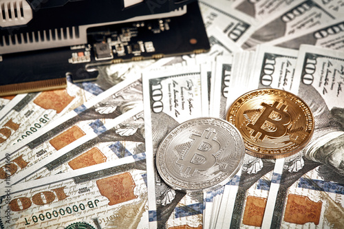 The Coins Of Bitcoin Lies On Dollars With Video Card Exchange - 