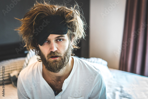 Fotografie, Obraz Guy sit by the bed after a night of drinking alcohol
