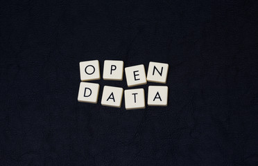 Wall Mural - open data text on a black leather surface. image taken in an angle.
