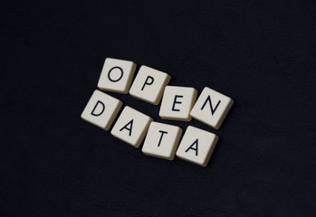 Wall Mural - open data text on a black leather surface. image taken in an angle.