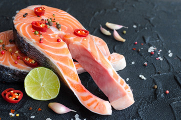 Two fresh raw salmon steaks with spices