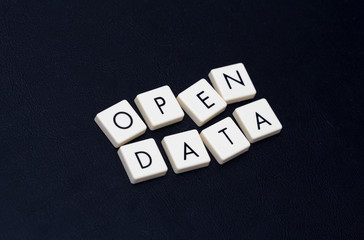 Wall Mural - open data text on a black leather surface. image taken in an angle.