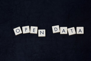 Wall Mural - open data text on a black leather surface.