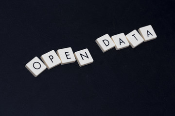 Wall Mural - open data text on a black leather surface. image taken in an angle.