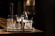 © Lior + Lone/Stocksy - Vintage glassware and bar gear on a bar counter