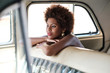 © Branislav Jovanovic/Stocksy - Beautiful African Woman Sitting Inside The Car