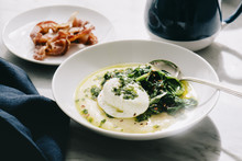 Poached Egg Over Creamy Polenta With Sauteed Spinach