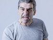 portrait of 40s to 50s white angry and upset guy and crazy furious and aggressive face expression nagging and complaining