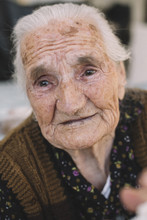 Old Woman With Tiers In Eyes