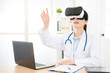 © PR Image Factory - happy doctor woman wearing virtual reality goggles