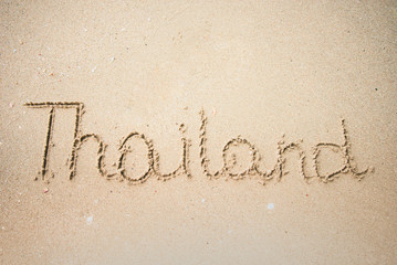 Wall Mural - Thailand word is written on the beach sand