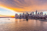 Fototapeta  - Brooklyn Bridge in a warm sky with sunset