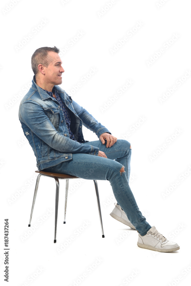 man sitting on a chair with white background - obrazy, fototapety, plakaty 