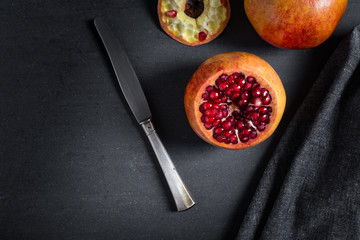 Poster - Sliced pomegranate with juicy red grains