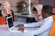 © FS-Stock - Beautiful phone operator Arab woman working in modern startup office