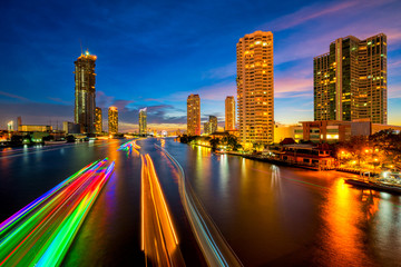 Fototapete - Light trails of traffic on the Chao Phraya river, Bangkok. Thailand. view from Taksin bridge Bangkok