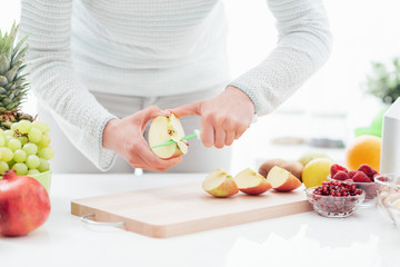 Wall Mural - Woman cutting apples