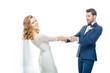 © LIGHTFIELD STUDIOS - beautiful wedding couple holding hands while dancing together isolated on white