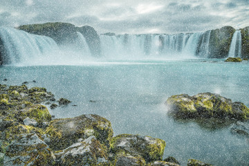 A beautiful waterfall Winter view, frozen motion of water streams on a long exposure. The most visited waterfall in Iceland. Waterfall Godafoss
