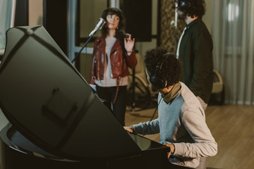 Wall Mural - group of musicians performing song in recording studio