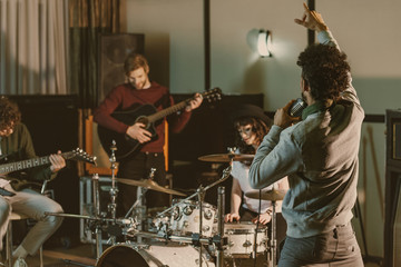 Wall Mural - rock music band playing at studio together