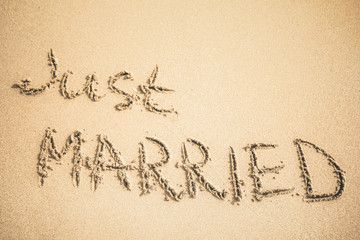 Wall Mural - Just Married text written on the sand