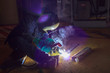 © eaumstocker - Welder perform welding to the metal plate at roof floor of manufacturing factory by using steel welding electrode in offshore oil and gas industrial operation, Blue collar jobs