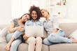 © Prostock-studio - Three happy beautiful women using laptop at home