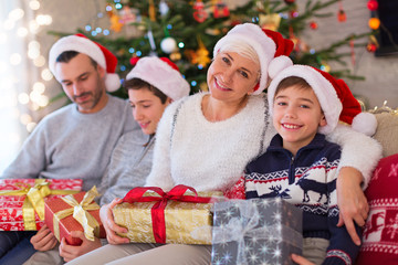 Wall Mural - Smiling family at Christmas 
