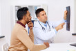 © Syda Productions - doctor with x-ray and male patient at clinic