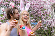 © Volodymyr - man and smiling girl with bunny ears holding eggs