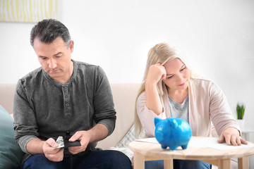 Poster - Mature couple with money at home