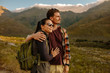 © Jacob Ammentorp Lund/Stocksy - Young couple on hiking trip admiring view