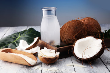 Wall Mural - Coconut products with fresh coconut, Coconut flakes, water and oil