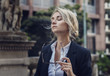 © xo4uphoto - Portrait of relaxed woman with her eyes closed in classic suit