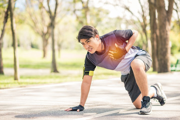 sport man having chest pain after running in the park , heart attack