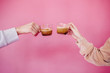 © Sergey Filimonov/Stocksy - Man and women clink glasses with coffee