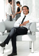 © ASDF - smiling businessman sitting in office chair