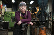 © Jetta Productions/Stocksy - Portrait of woman in blacksmith shop
