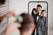 © Sergey Filimonov/Stocksy - Hairstylist doing haircut