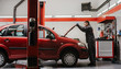 © Marko Milanovic/Stocksy - Mechanic working on car in garage/workshop