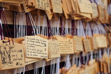 Detail Of Wishes Written On The Wooden Boards Called "emas" Placed By Visitors At The Meiji Shrine, A Temple Dedicated To The Emperor Meiji And His Wife.