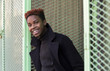© Fjello/Stocksy - Young black man smiling.